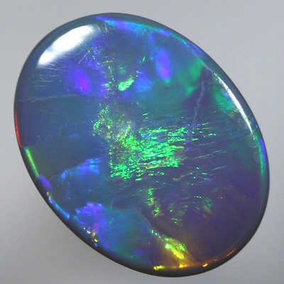 SOLID SEMI BLACK OPAL Large rolling flashes, neon orange to green